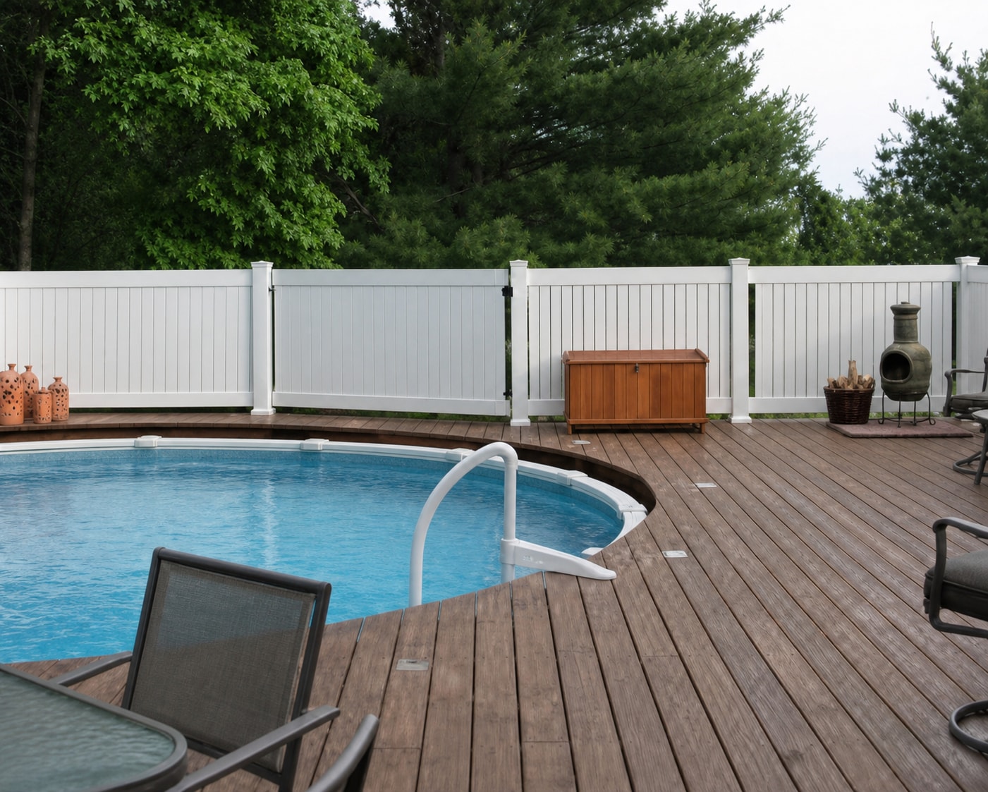 Poolside vinyl fence installation