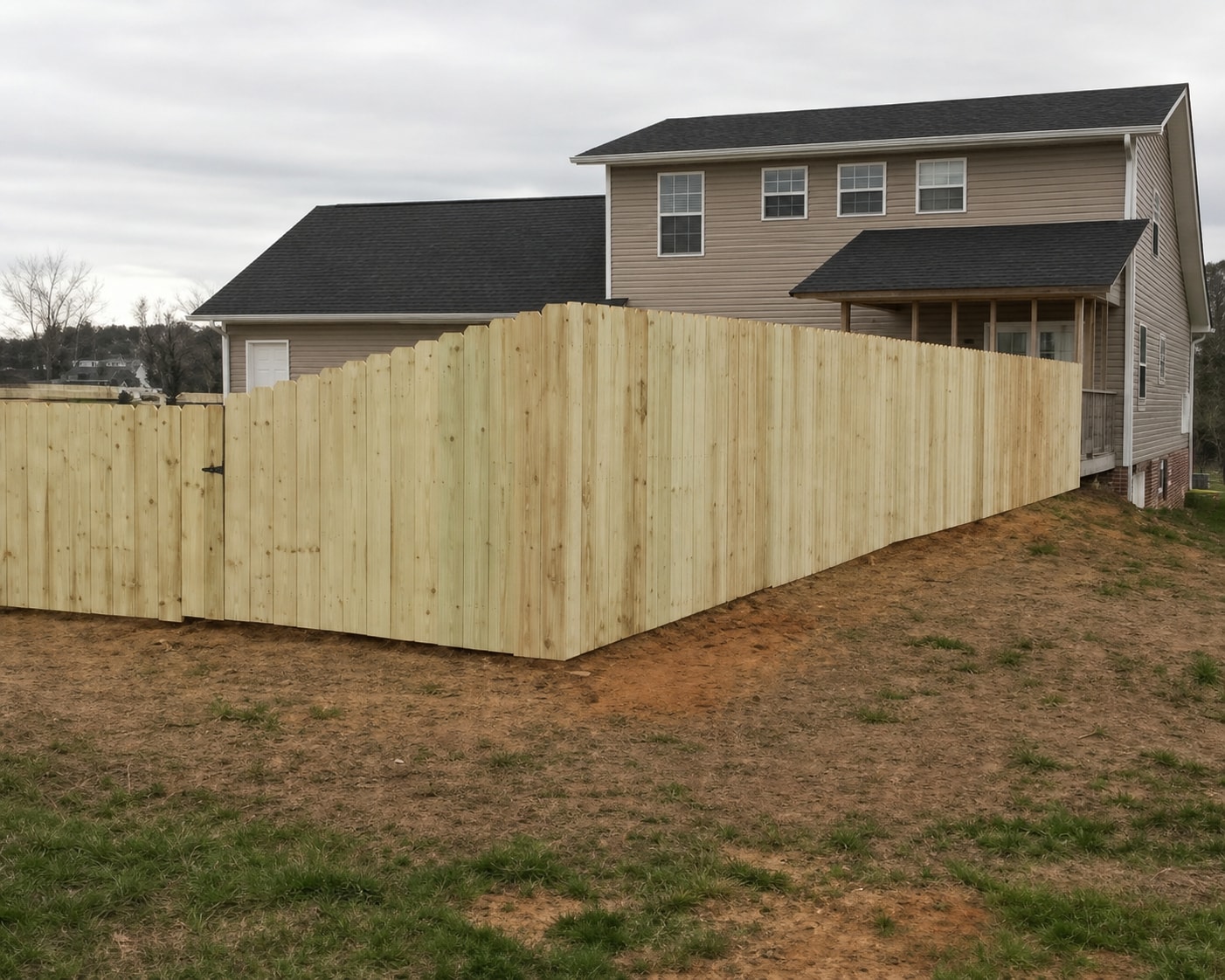 Wood privacy fence installation